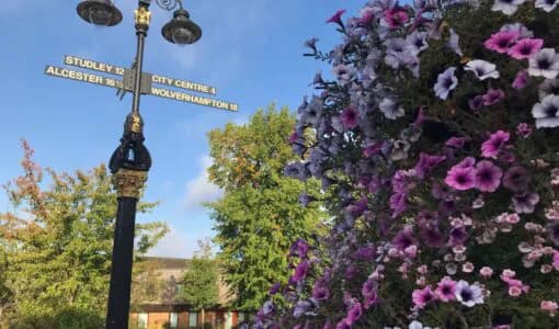 Flowers and a heritage lamp post at Kings Heath Village Square