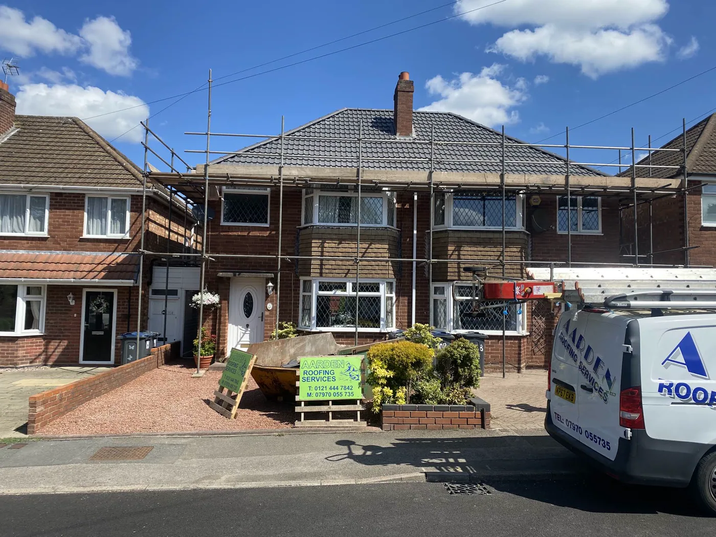 A completed roof by Aarden Roofing with the company van outside