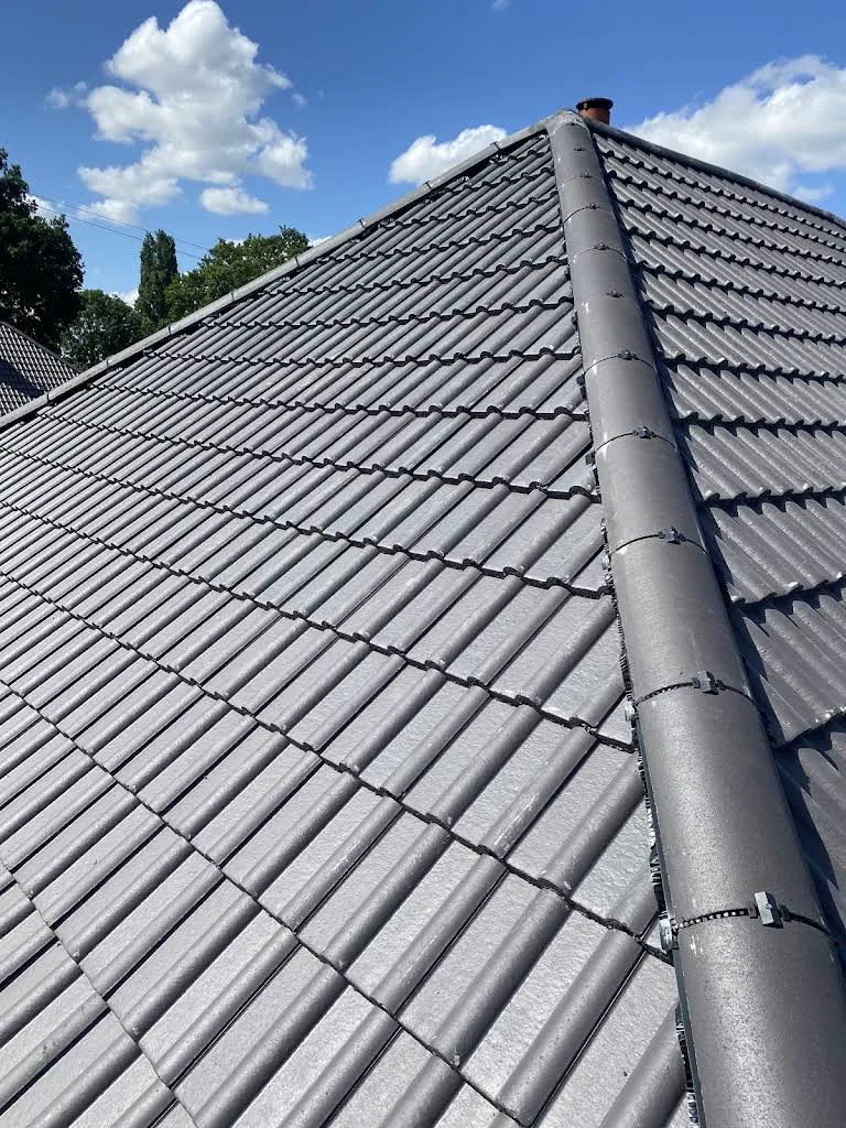 Finished tiled roof and ridge completed by Aarden Roofing