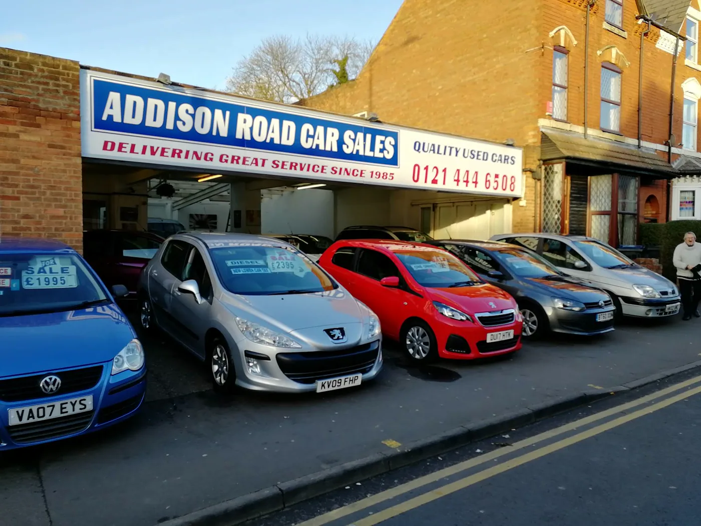 Used cars displayed outside Addison Road Car Sales