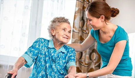A home carer talking with an older client