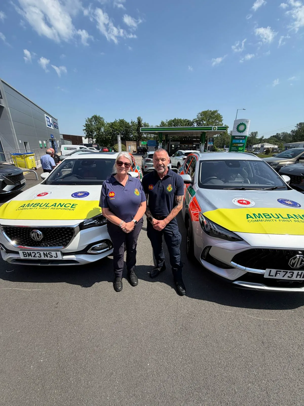 Arrive Alive volunteers with two emergency response vehicles
