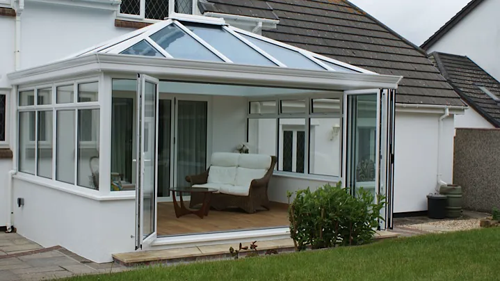 Conservatory opening onto a garden installed by Avonview of Hollywood