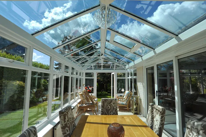 Glass-roofed conservatory dining room