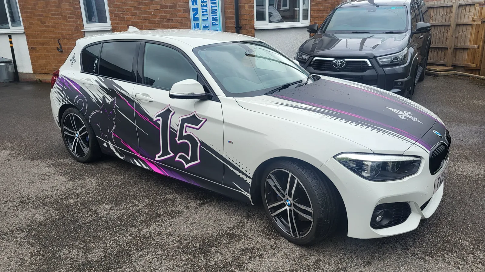 Custom black, white and purple BMW vehicle wrap completed by Baker Ward Signwriting