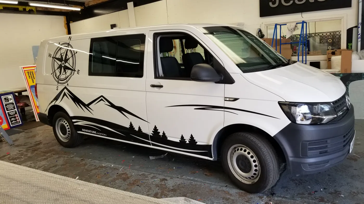 Mountain-themed commercial van wrap completed by Baker Ward