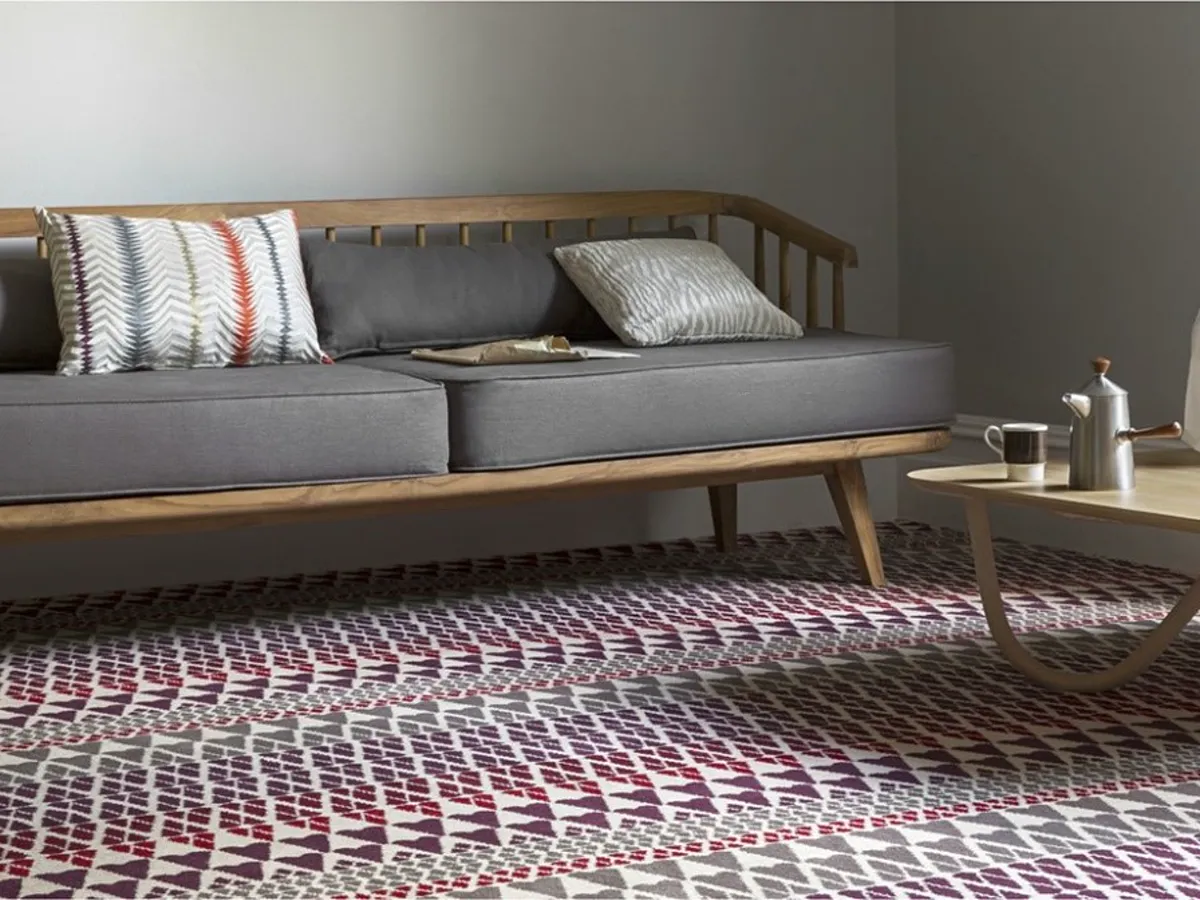 Patterned carpet in a furnished room