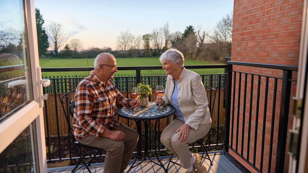 Residents enjoying a balcony at Highbury Lodge