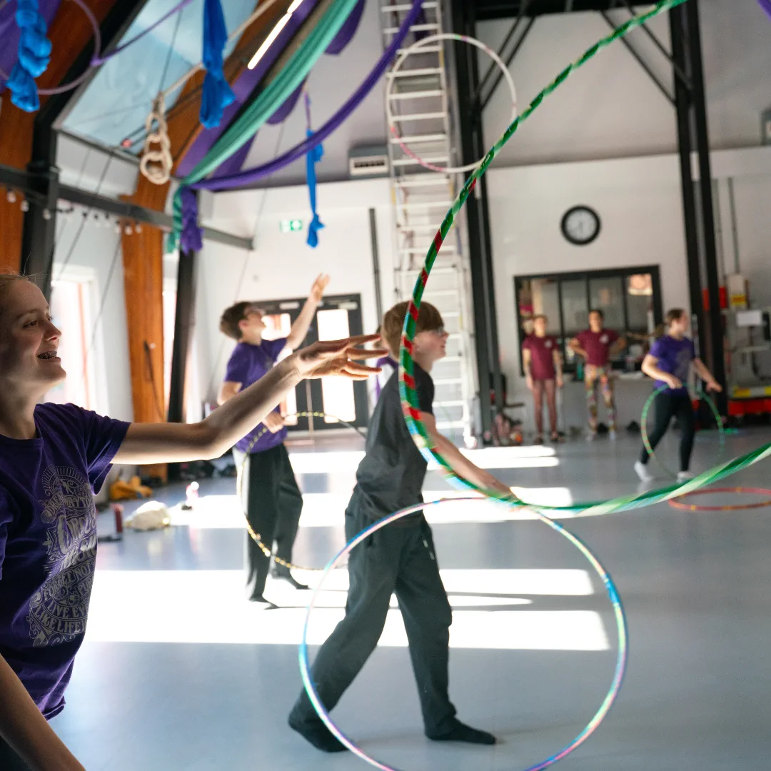 Young CircusMASH participants practising hoop skills