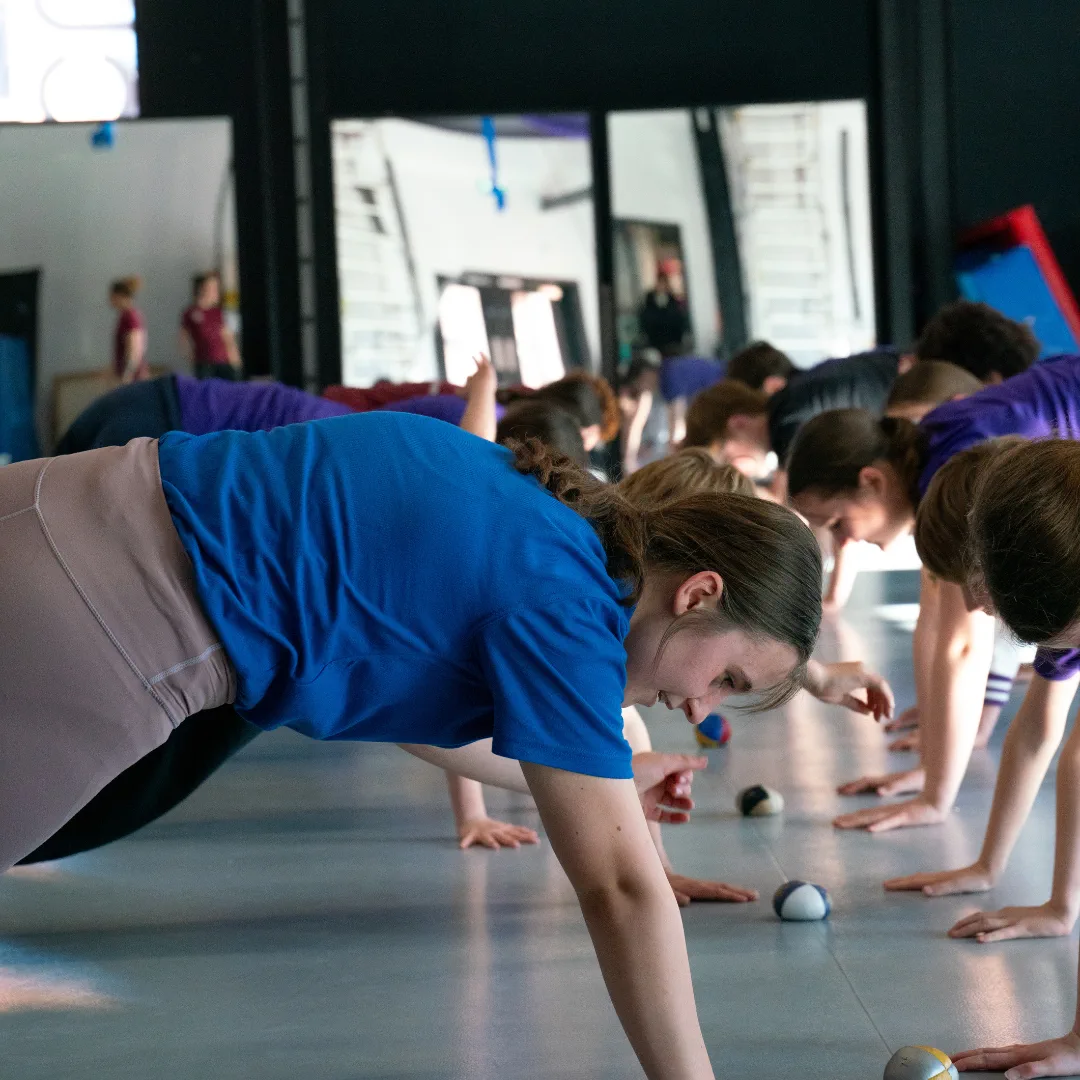 Young CircusMASH participants practising floor skills together