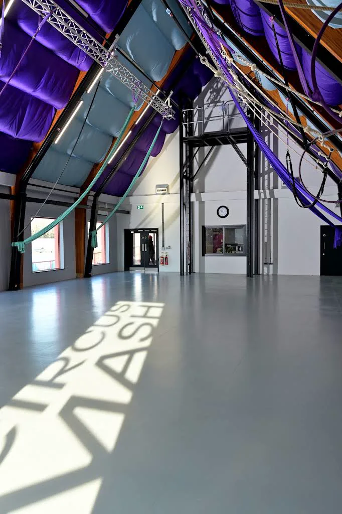 The CircusMASH training studio with aerial equipment rigged above the floor