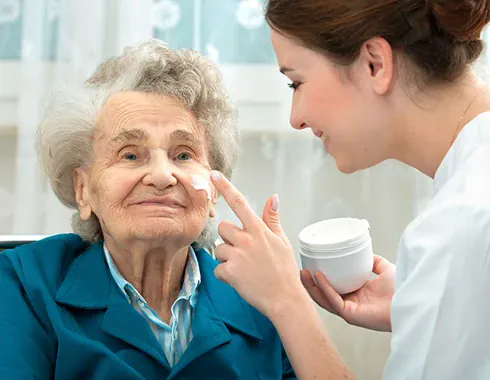 A care worker providing personal care at home
