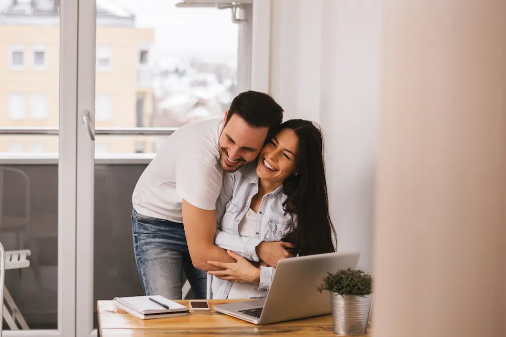 Homebuyers reviewing mortgage information together
