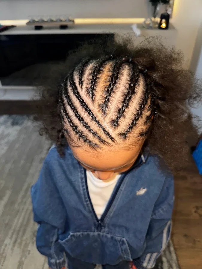 Braided natural hairstyle created at Elishaddai salon
