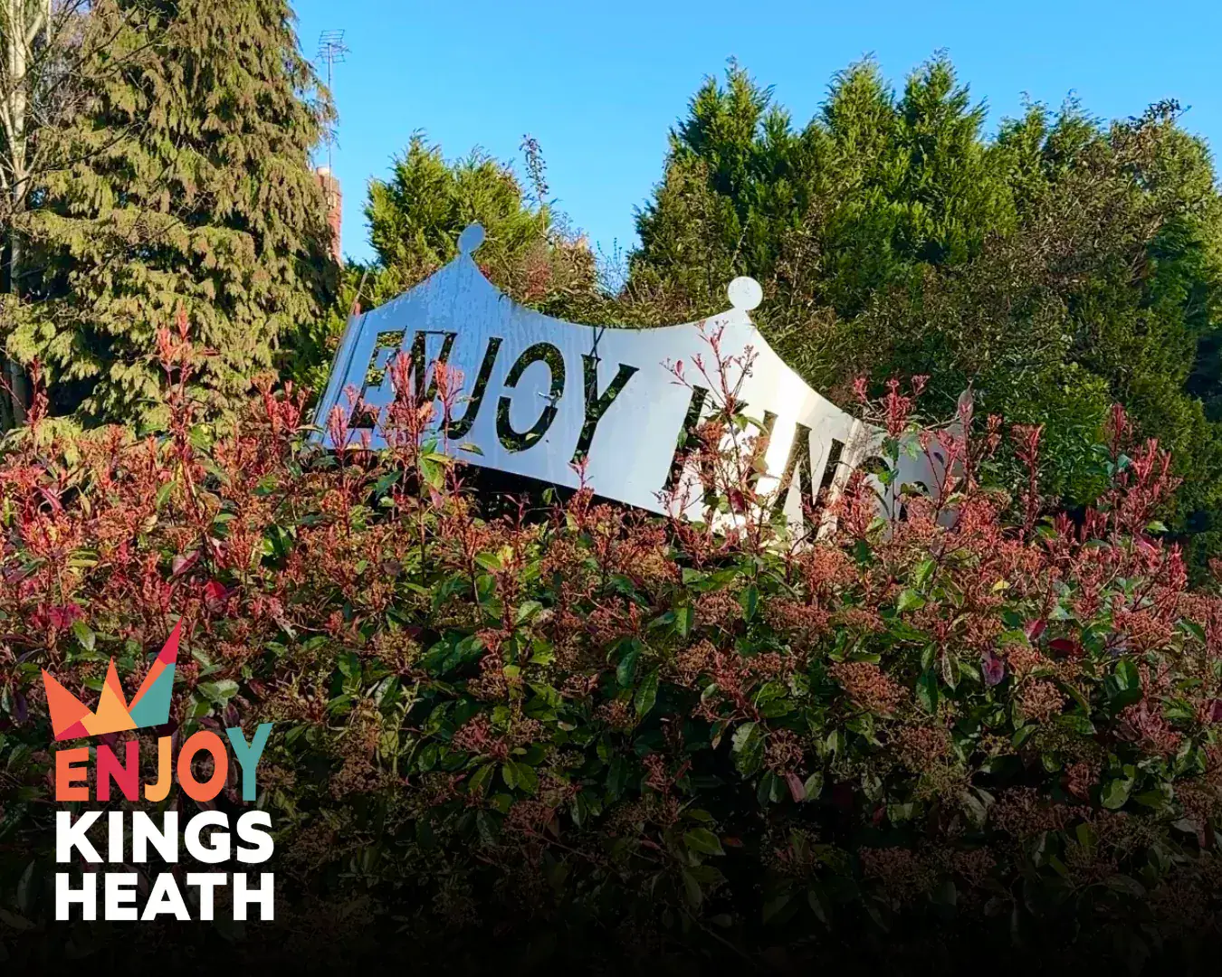 Enjoy Kings Heath sign surrounded by planting