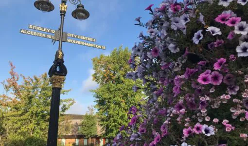 Flowers and a heritage lamp post at Kings Heath Village Square