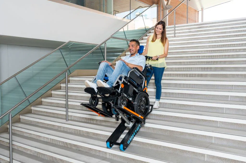 Wheelchair user descending stairs with an Evaccess powered stair climber