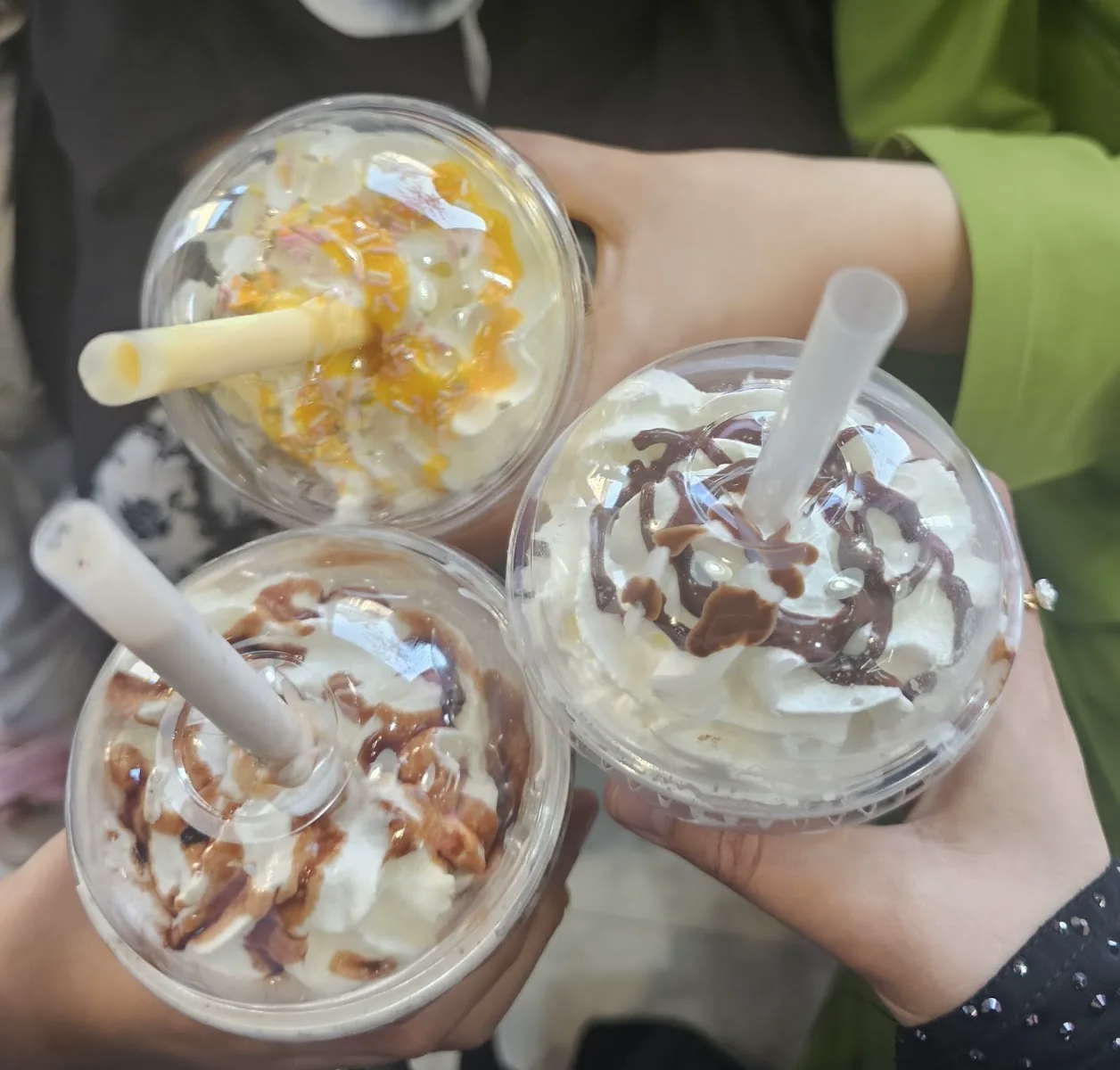 Milkshakes topped with cream and sauces at Ever So Sweet