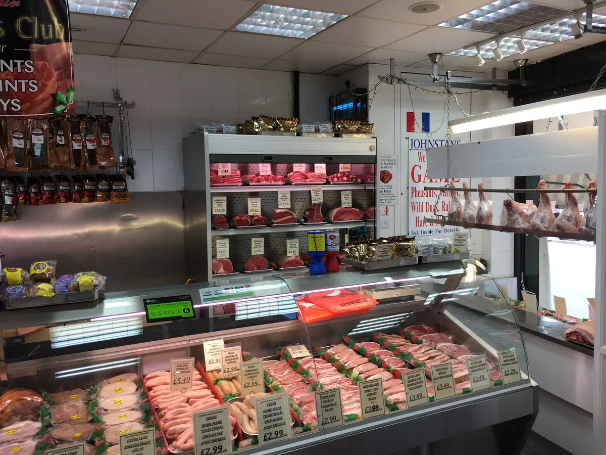 Meat counter and displays inside Johnstans Butchers