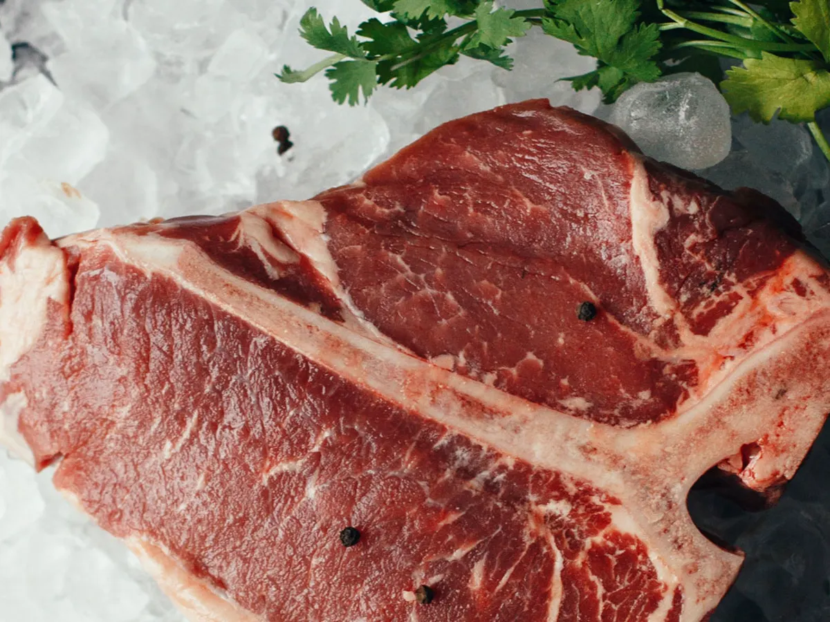 T-bone steak displayed on ice at Johnstans Butchers