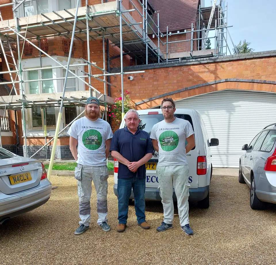 JRS Decorators team beside their branded work van