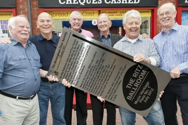 Local musicians holding the Ritz Ballroom musical heritage plaque in Kings Heath
