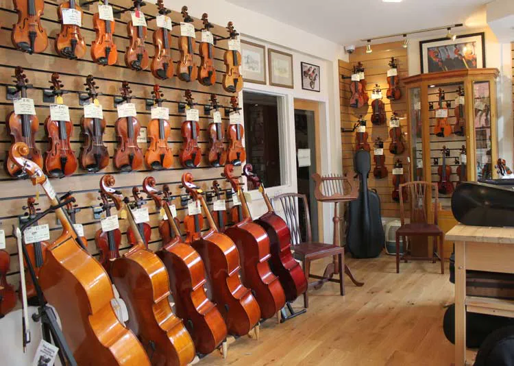 Violins displayed inside the Moseley Violins shop