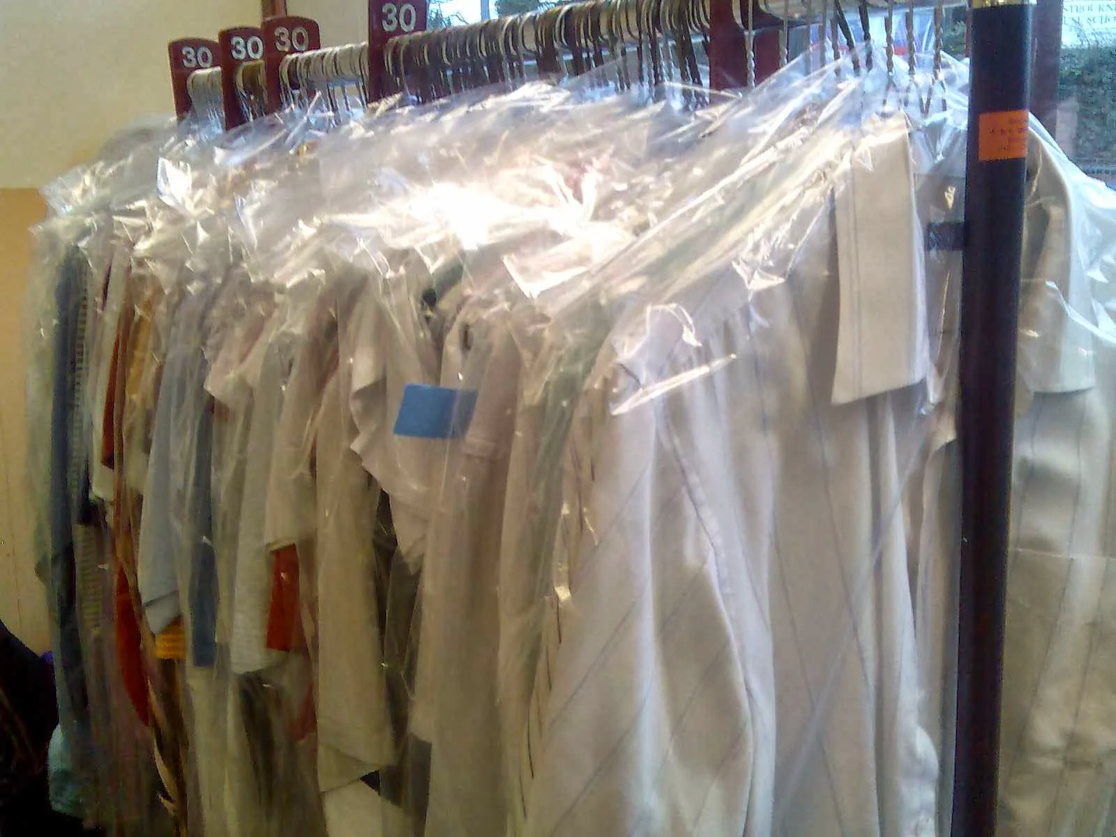 Dry-cleaned garments ready for collection at Swift Launderette
