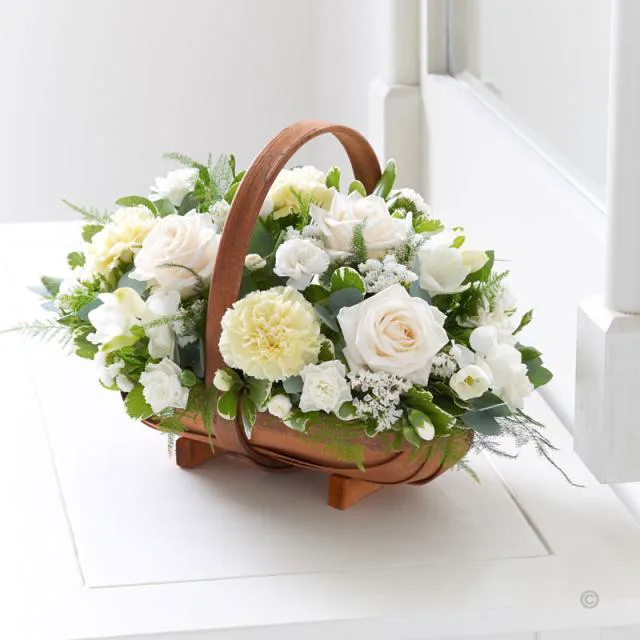 White rose and carnation basket arrangement by Whoops a Daisy